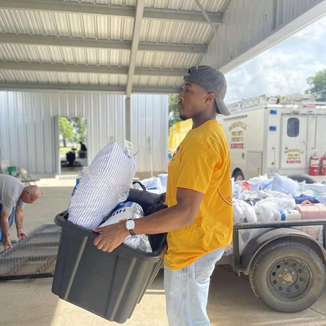 Volunteer carrying relief supplies