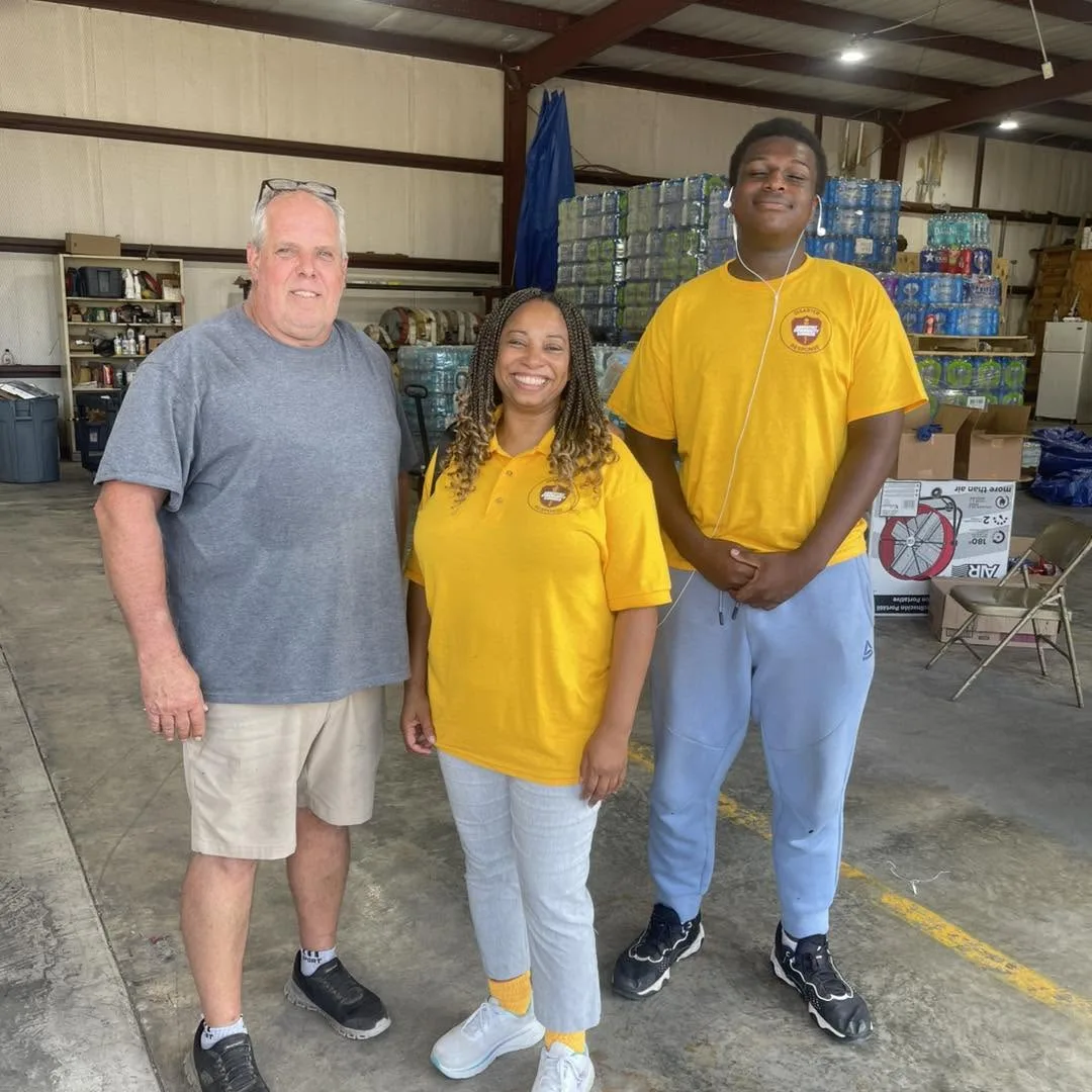 Community members and ACS volunteers together