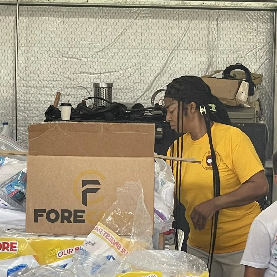 Volunteer sorting donated supplies