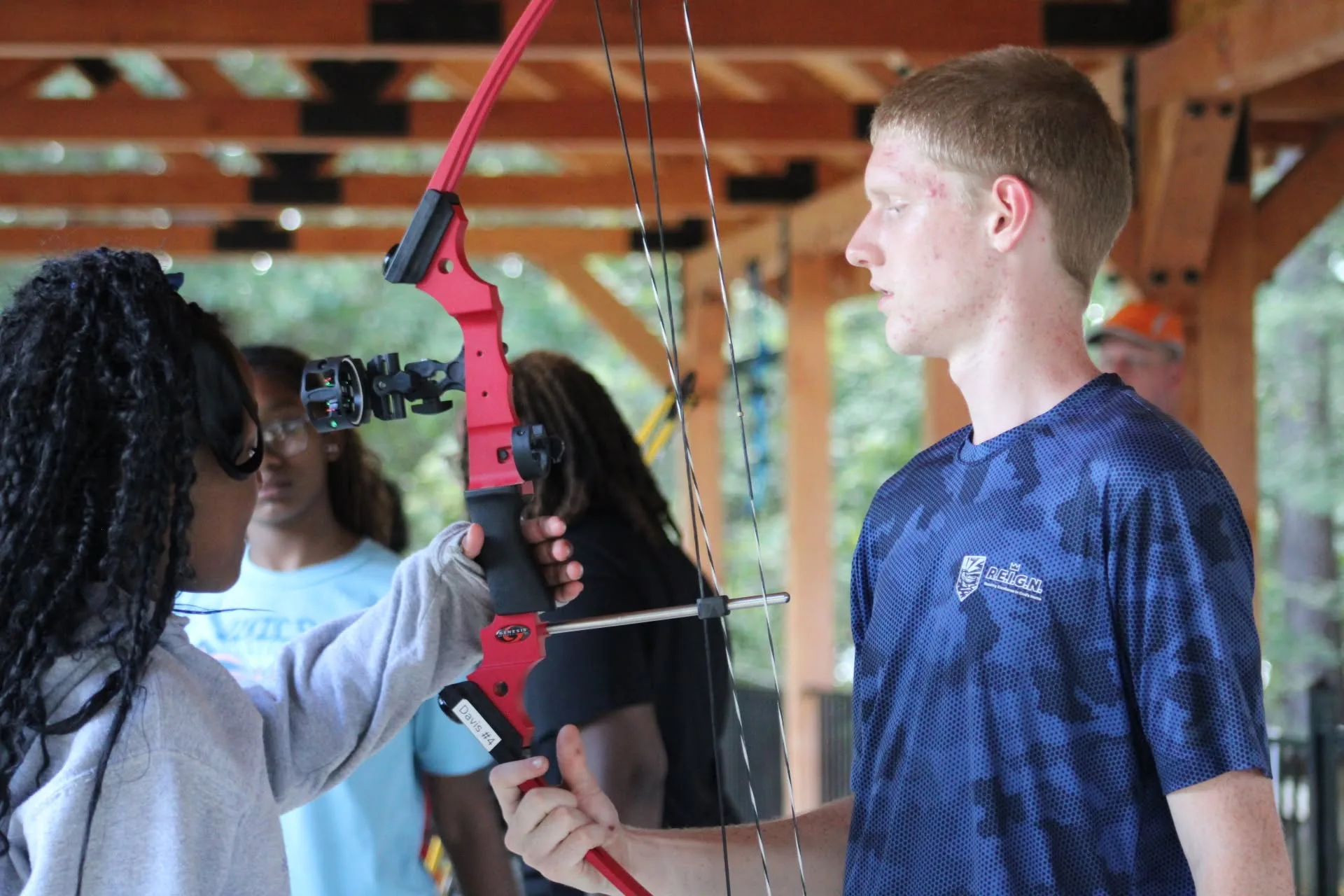Camper learning archery